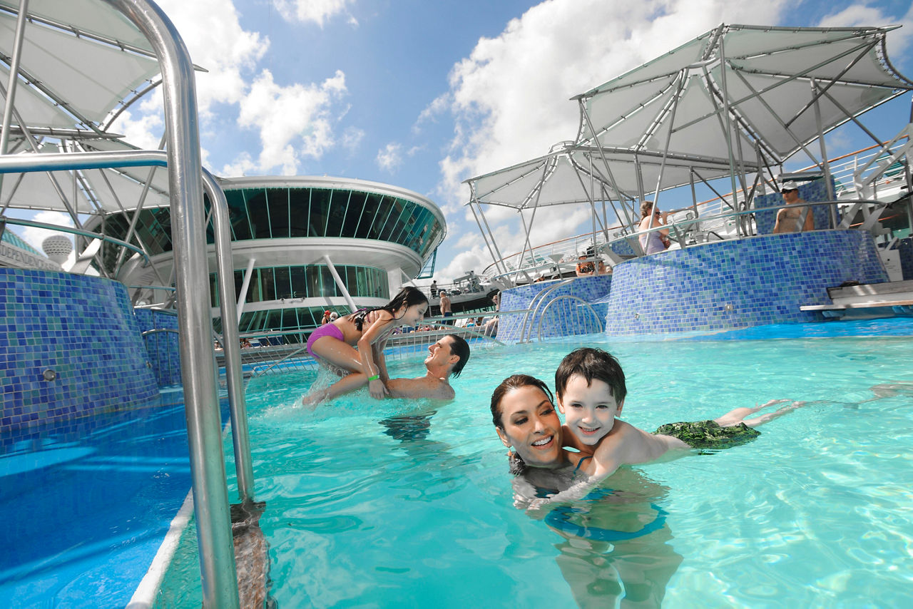 Couple with their Kids in the Pool 