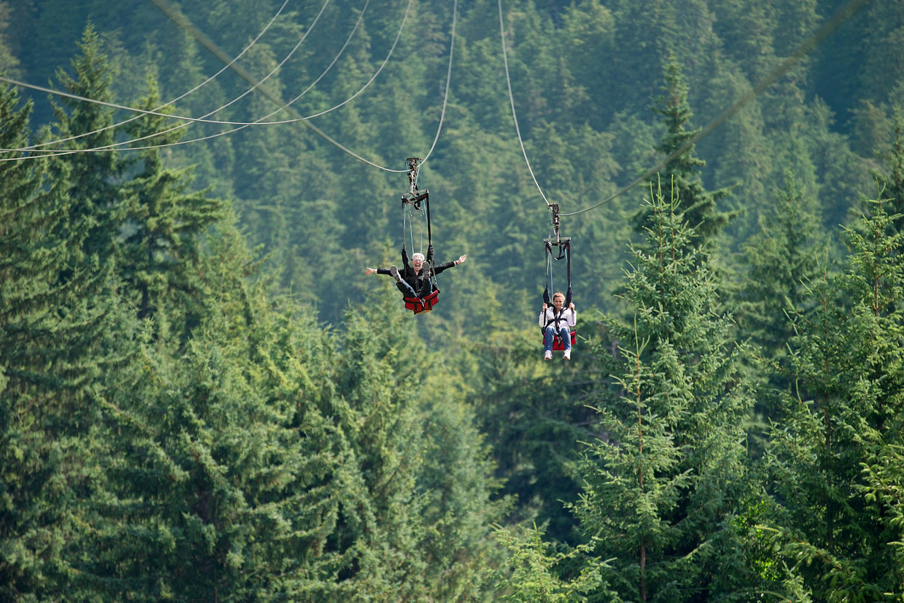 A Couple Zip Riding Through the Mountains, Icy Strait Point, Alaska