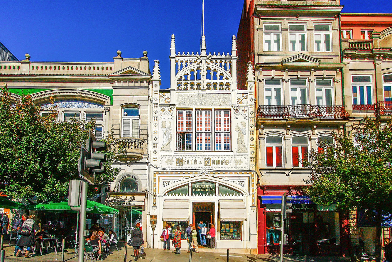 Magenta-carpeted wooden stairs of the famous Livraria (Bookstore) Lello in Porto, Portugal