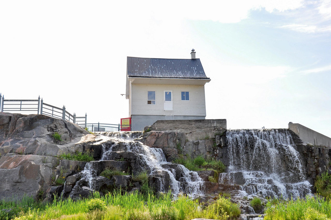 La Petite Maison Blanche, the little white house that withstood a disastrous flood and became a symbol of perseverance, in Saguenay, Quebec