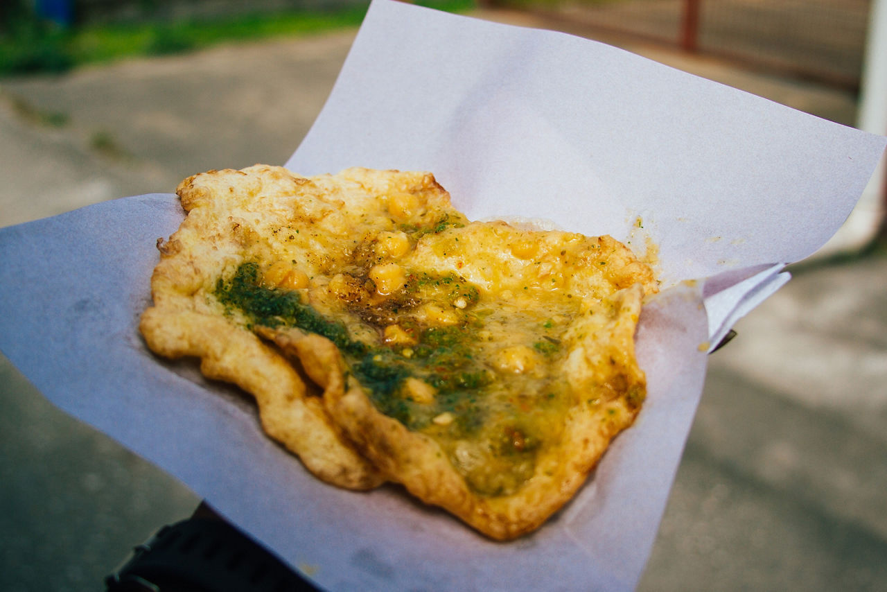 Hand holding Trinidad doubles