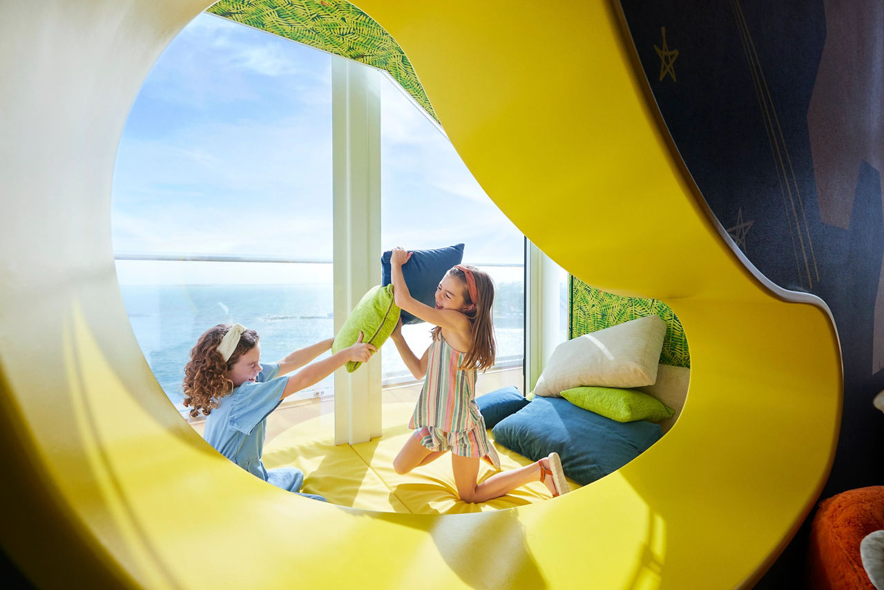 Icon of the Seas kids playing with pillows in Ultimate Family Townhouse