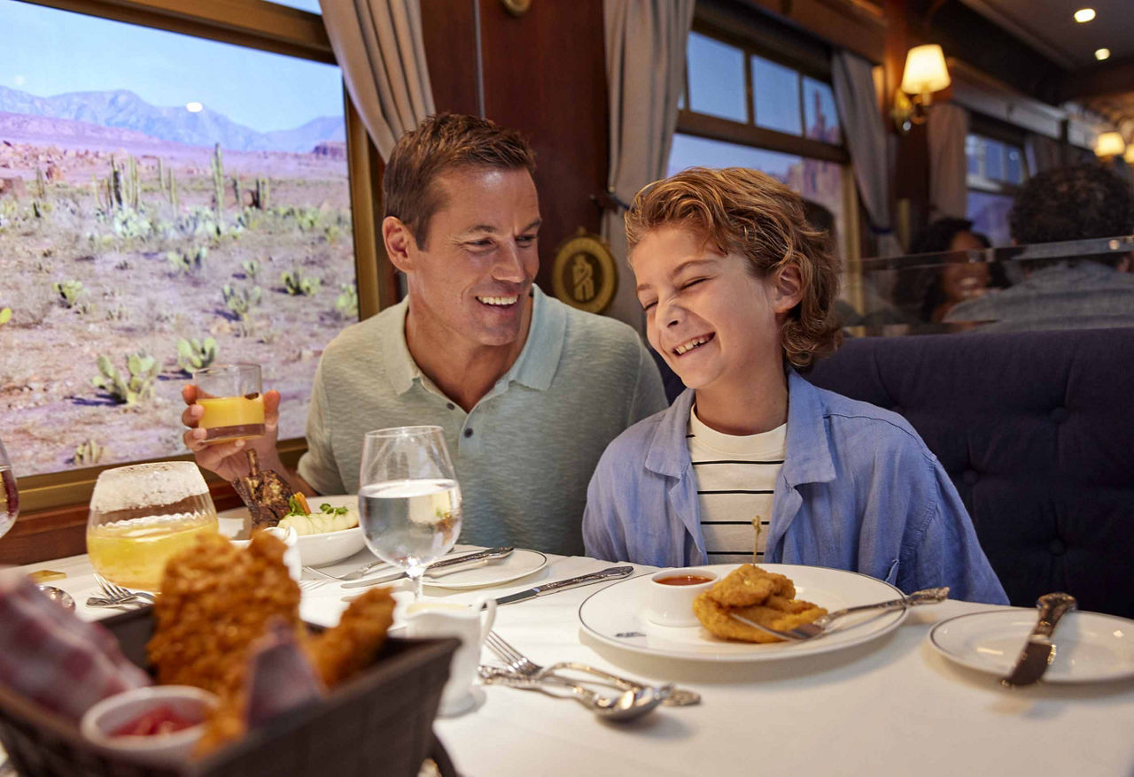 Dad and son eating at Utopia Station